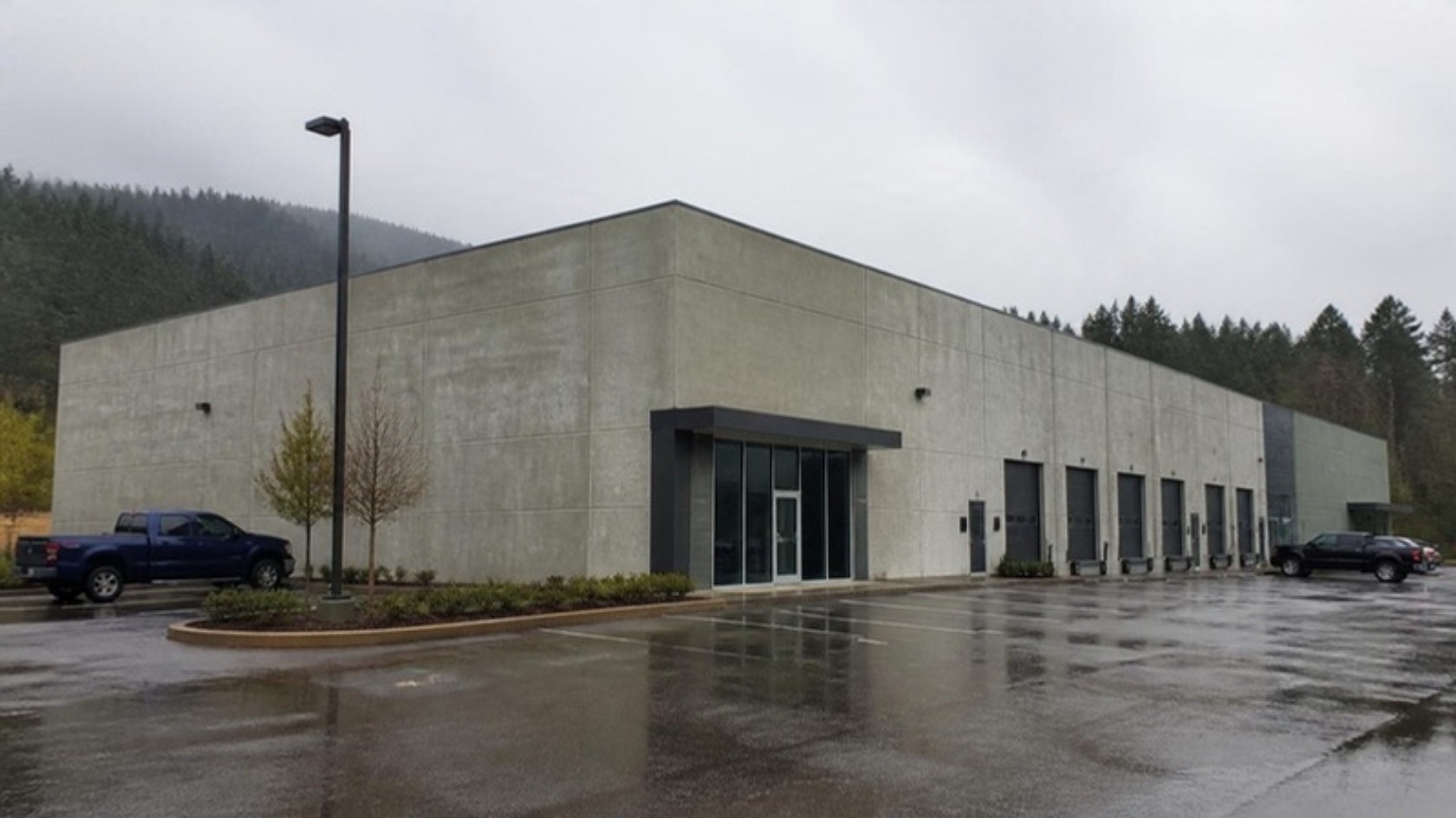 Finished concrete warehouse building with loading doors